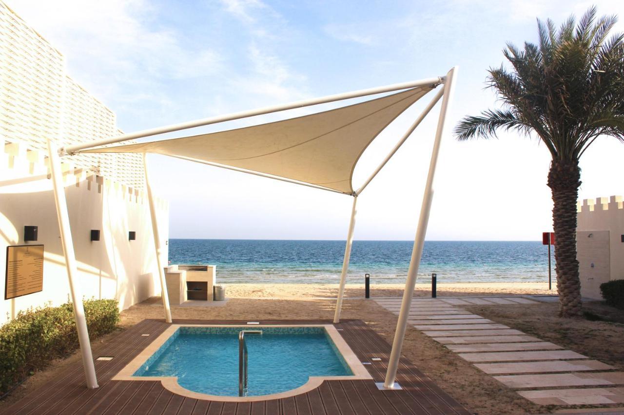 Sealine Beach, A Murwab Resort Mesaieed Ngoại thất bức ảnh A shade sail over a swimming pool